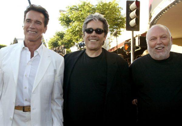 Actor Arnold Schwarzenegger (L), star of the futuristic action thriller "Terminator 3 Rise of the Machines" poses with the film's producers Mario Kassar (C) and Andrew Vajna (R) at the film's premiere in Los Angeles, on June 30, 2003. (Reuters/Fred Prouser)