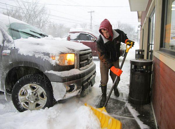 Carter Martin working at Maplefields store and gas station in Plainfield, Vt., on Jan. 20, 2019. (Lisa Rathke/AP)