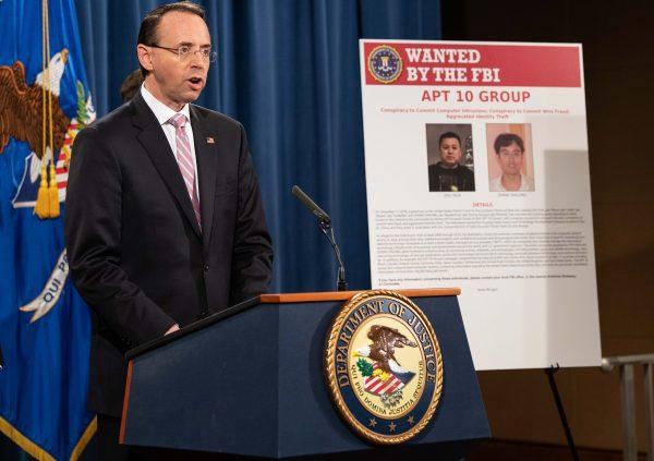  Deputy Attorney General Rod Rosenstein speaks at a press conference about Chinese hacking at the Justice Department in Washington on Dec. 20, 2018. The Justice Department announced new indictments of Chinese regime hackers who allegedly targeted scores of companies in a dozen countries, which U.S. officials said showed Beijing had not fulfilled its pledge to stop such actions. (Nicholas Kamm/AFP/Getty Images)