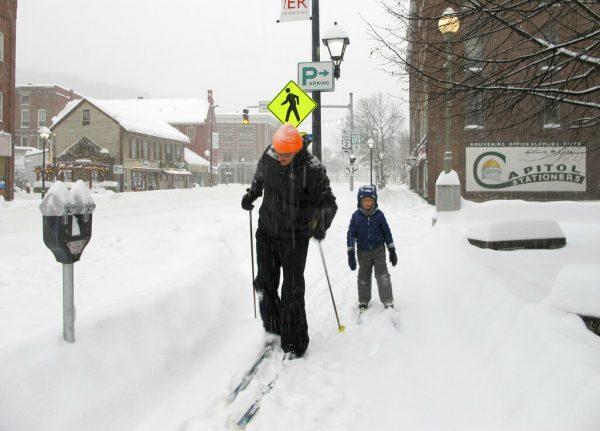 Nicholas Nicolet and his son Rocco cross-country ski in Montpelier, Vt., on Jan. 20, 2019. (Lisa Rathke/AP)