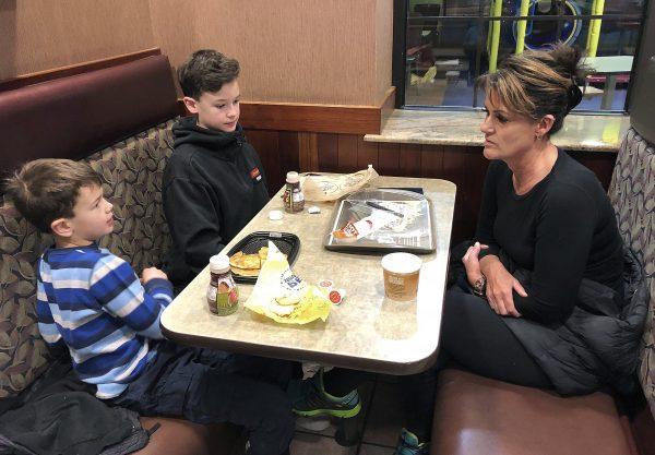 Tamra Cartwright, right, talks with sons Connor, 7, left, and Caden, 11, about the effect of multiple aftershocks from Alaska's recent magnitude 7.0 earthquake while interviewed in Anchorage, Alaska, on Jan. 10, 2019. (Rachel D'Oro/AP)