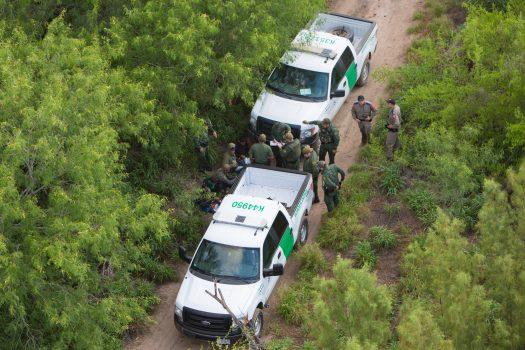 Texas Border Patrol and Texas state troopers detaining aliens after they came over to the United States from Mexico in the Texas area near Hidalgo, Texas, on May 30, 2017. (Benjamin Chasteen/The Epoch Times)