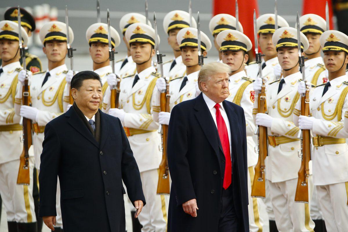 President Donald Trump takes part in a welcoming ceremony with Chinese leader Xi Jinping in Beijing on Nov. 9, 2017. (Thomas Peter-Pool/Getty Images)