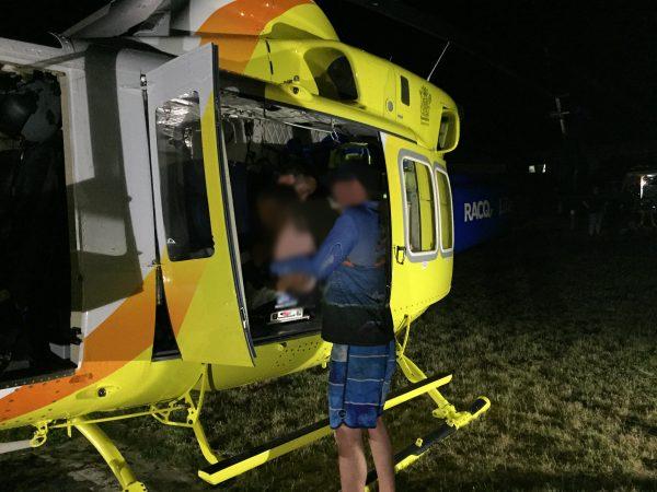 A 6-year-old boy is loaded into an air ambulance on Fraser Island, Queensland, after being bitten by a dingo on Jan. 19, 2019. (RACQ LifeFlight Rescue)