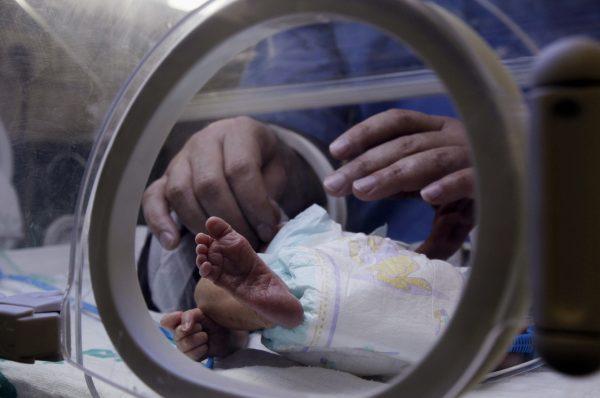 A nurse changes the diaper of an infant in Gaza city in this file image of an incubator on Feb. 16, 2012. (Mohammed AbedD/AFP/Getty Images)