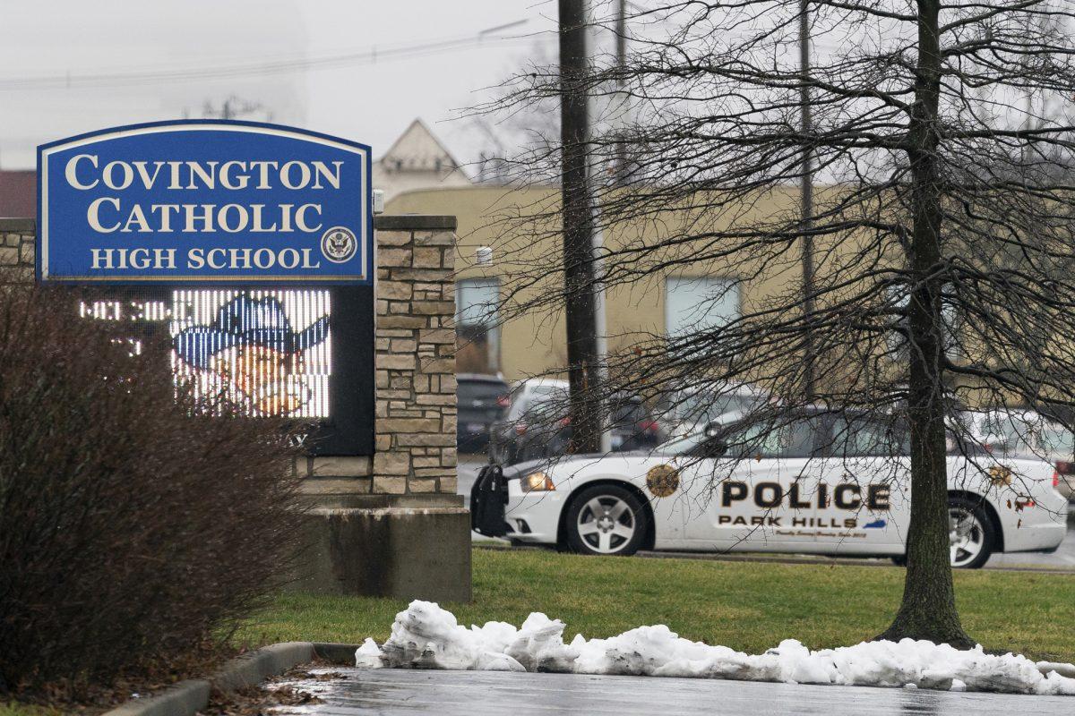 A police car sits at the entrance to Covington Catholic High School in Park Hills, Ky., on Jan 19, 2019. (Bryan Woolston/AP Photo)