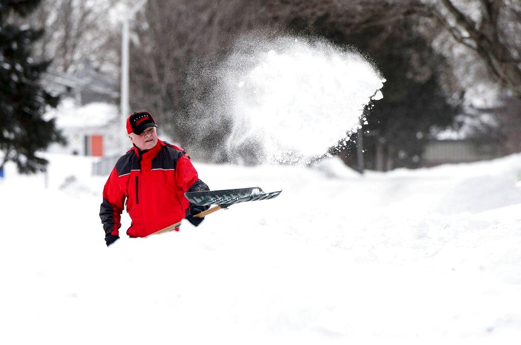 Jeff Maguire digs out his driveway in Carleton Place, Ontario on Monday, Jan. 21, 2019. (Sean Kilpatrick/The Canadian Press via AP)