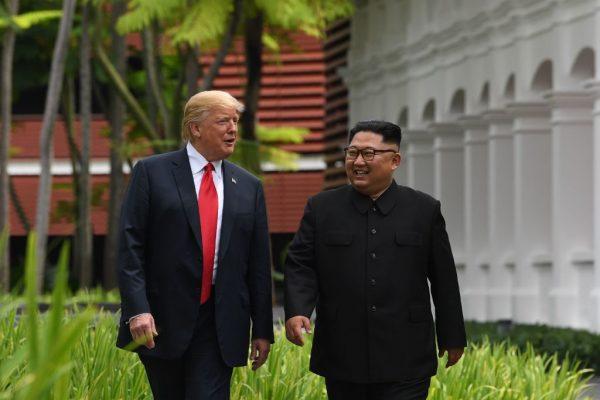 U.S. President Donald Trump and North Korean leader Kim Jong Un during a break in talks at their historic U.S.-North Korea summit in Singapore on June 12, 2018. (Saul Loeb/AFP/Getty Images)