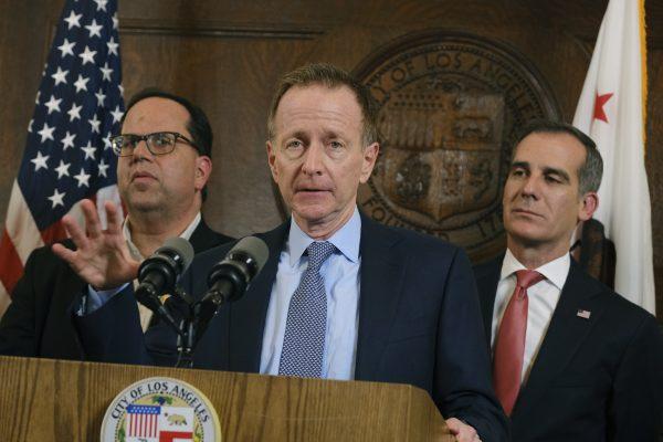 Austin Beutner, Superintendent of the Los Angeles Unified School District (Center) talks to the media, flanked by United Teachers Los Angeles Union President Alex Caputo-Pearl (L) and Los Angeles Mayor Eric Garcetti, after a news conference in Los Angeles City Hall on Jan. 22, 2019. (Richard Vogel/AP)