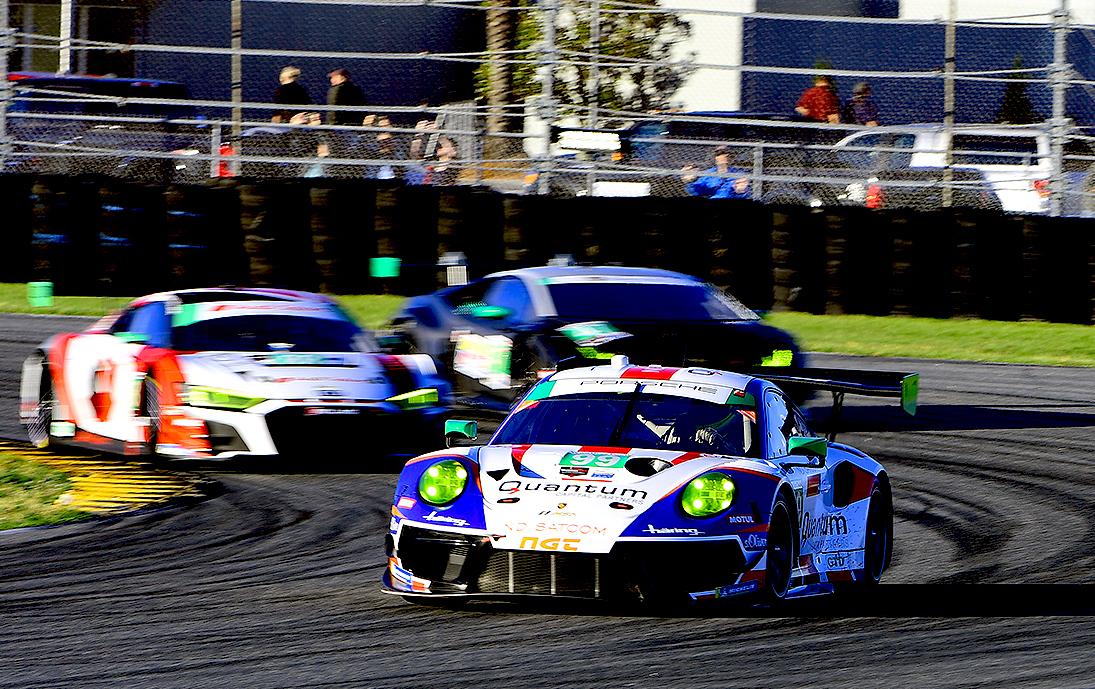  GTD racing at its best: the #99 NGT Motorsport Porsche 911 GT3 R leads a pair of competitors side-by-side into Turn 3. (Bill Kent/Epoch Times)