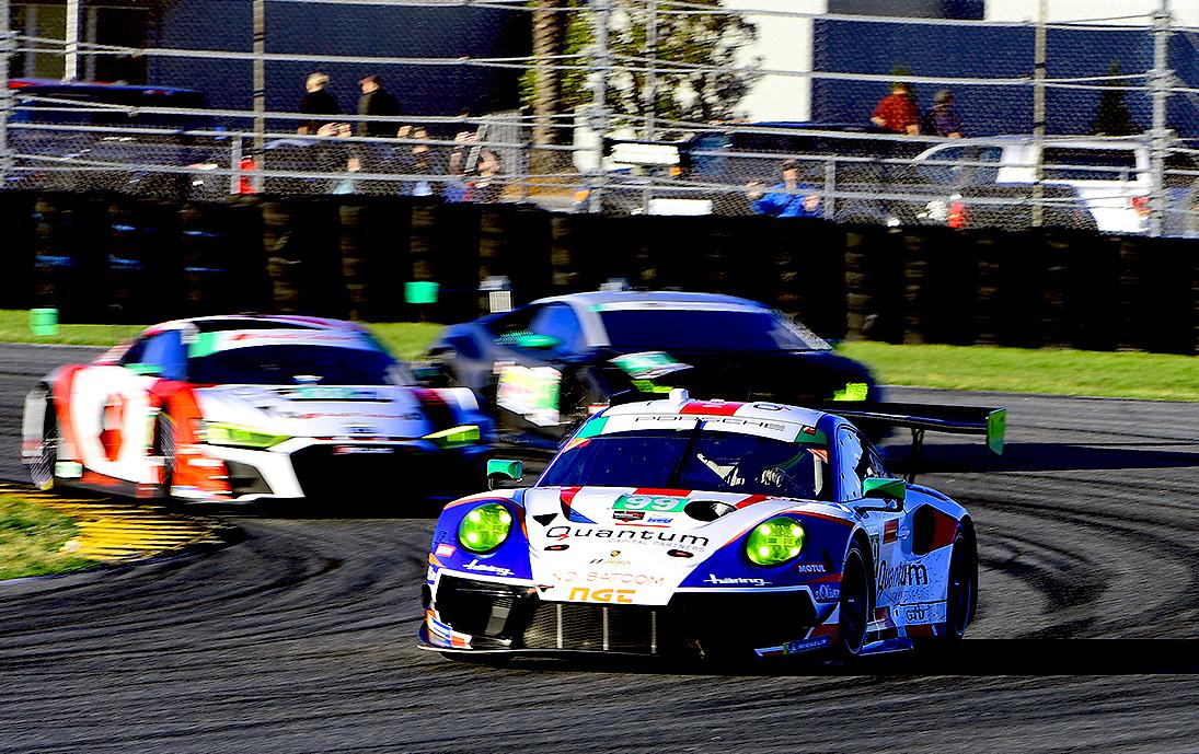 GTD racing at its best: the #99 NGT Motorsport Porsche 911 GT3 R leads a pair of competitors side-by-side into Turn 3. (Bill Kent/Epoch Times)