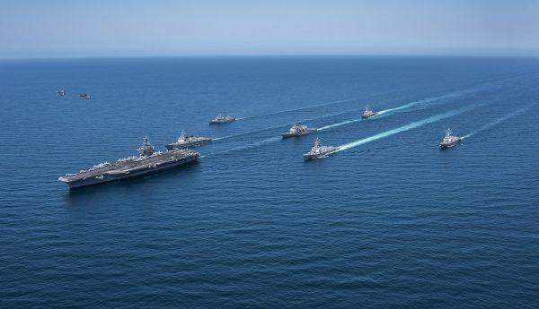 Hornets and Super Hornets from Carrier Air Wing (CVW) Two fly over the Republic of Korea destroyers Sejong the Great (DDG 991) and Yang Manchun (DDH 973), the Arleigh Burke-class guided-missile destroyers USS Wayne E. Meyer (DDG 108), USS Michael Murphy (DDG 112) and USS Stethem (DDG 63), the Ticonderoga-class guided-missile cruiser USS Lake Champlain (CG 57) and the Nimitz-class aircraft carrier USS Carl Vinson (CVN 70) as they transit the western Pacific Ocean, on May 3, 2017. (Sean M. Castellano US Navy/Getty Images)
