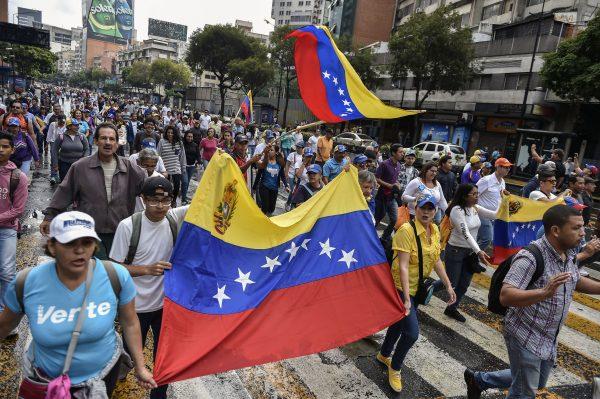 Venezuelan opposition supporters take part in a march on the anniversary of 1958 uprising that overthrew military dictatorship in Caracas, on Jan. 23, 2019. (Luis Robayo/AFP/Getty Images)