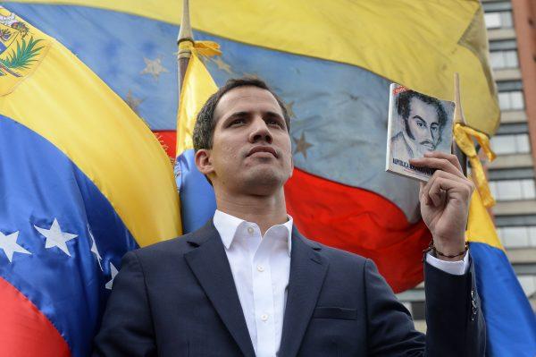 Venezuela's National Assembly head Juan Guaido declares himself the country's "acting president" during a mass opposition rally against leader Nicolas Maduro, on the anniversary of 1958 uprising that overthrew military dictatorship in Caracas on Jan. 23, 2019. -(Federico Parra/AFP/Getty Images)