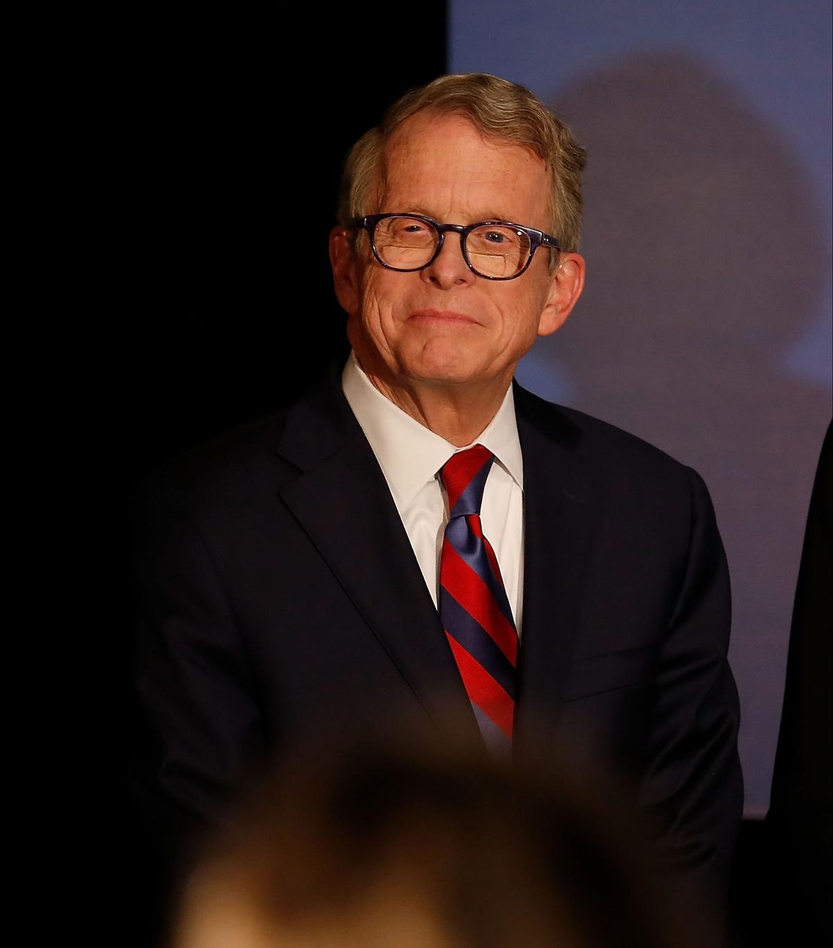 Republican Gubernatorial Candidate Ohio Attorney General Mike DeWine listens as Governor John Kasich gives a speech endorsing DeWine ahead of Tuesday's elections during a campaign event at the Boat House at Confluence Park in Columbus, Ohio, on Nov. 2, 2018. (Kirk Irwin/Getty Images)