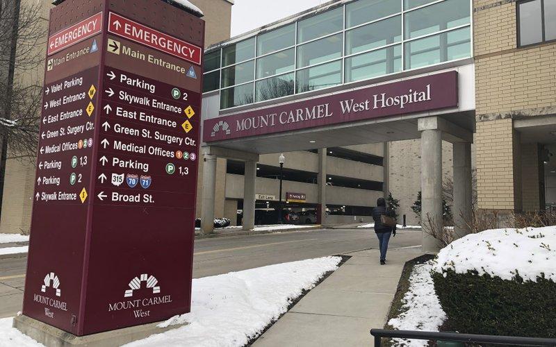 In this Jan. 15, 2019 file photo, the main entrance to Mount Carmel West Hospital is shown in Columbus, Ohio. (AP Photo/Andrew Welsh Huggins, File)
