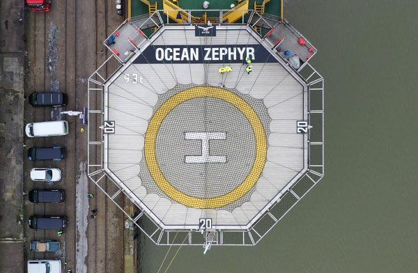 People stand on the helipad of the Ocean Zephyr in the docks in Bremerhaven, Germany, on Jan. 23, 2019. (Stephen Barker/AP Photo)