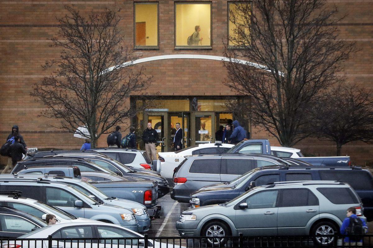 Students arrive at Covington Catholic High School as classes resume following a closing due to security concerns the previous day on Jan. 23, 2019, in Park Hills, Ky. (AP Photo/John Minchillo)