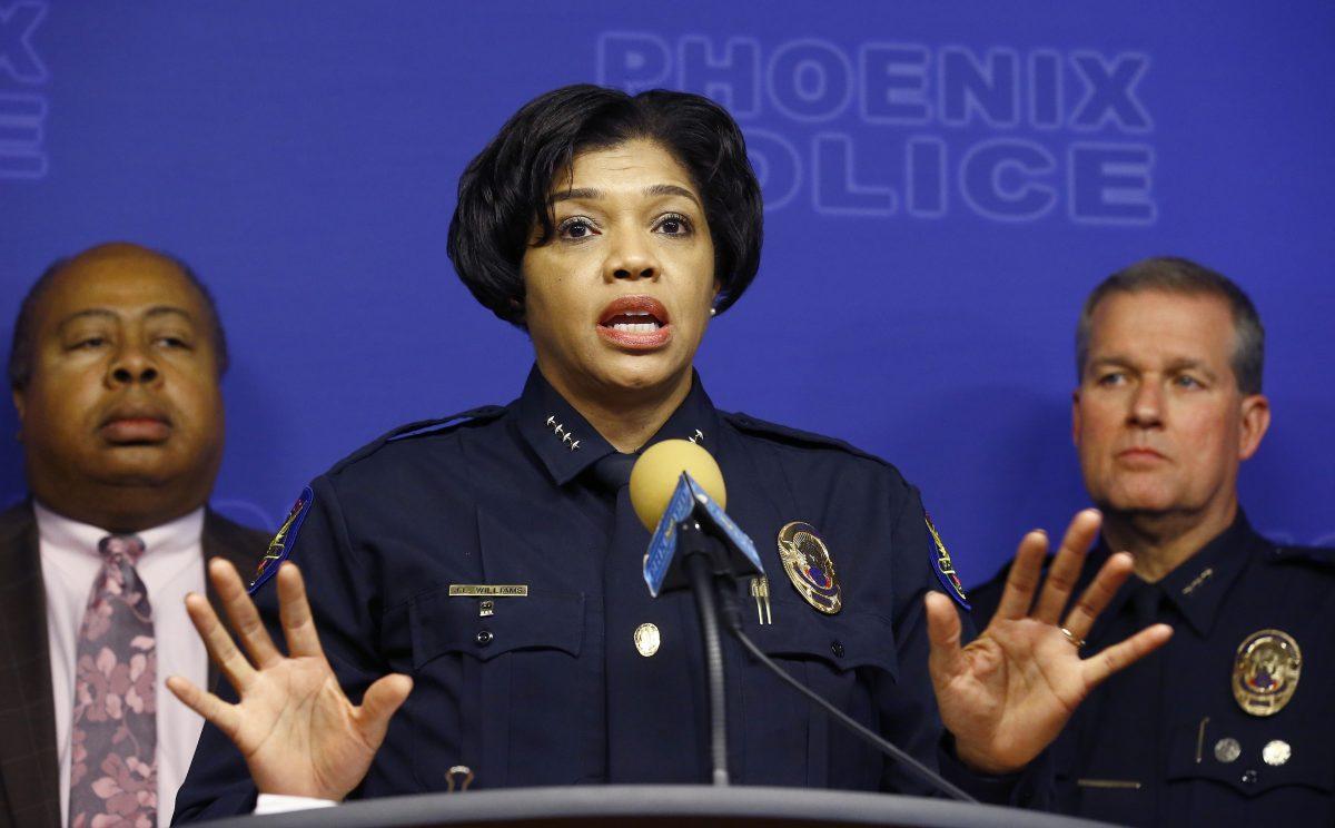 Joined by other police officials and city leaders, Phoenix Police Chief Jeri Williams announces the arrest of Nathan Sutherland, a licensed practical nurse, on one count of sexual assault and one count of vulnerable adult abuse on an incapacitated woman who gave birth last month at a long-term health care facility on Jan. 23, 2019. (AP Photo/Ross D. Franklin)