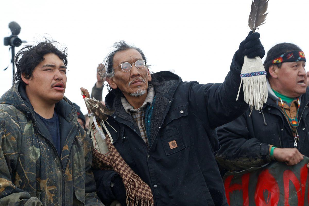 Nathan Phillips, center, with other protesters near the main opposition camp against the Dakota Access oil pipeline near Cannon Ball, North Dakota, on Feb. 22, 2017. (Terray Sylvester/Reuters)