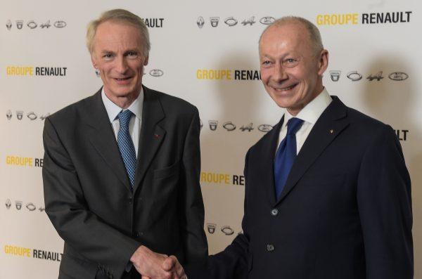 French carmaker Renault's newly appointed board chairman Jean-Dominique Senard (L) shakes hands with new chief executive Thierry Bollore during a press conference at the headquarters of the French car manufacturer Renault in Boulogne Billancourt, near Paris on Jan. 24, 2019. (Eric Piermont/AFP/Getty Images)