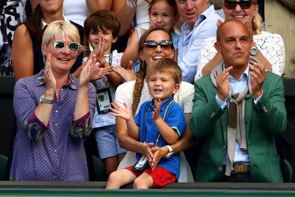 Jelena Djokovic (C), wife of Novak Djokovic of Serbia, and their son Stefan Djokovic applaud after the Men's Singles final on day thirteen of the Wimbledon Lawn Tennis Championships at All England Lawn Tennis and Croquet Club in London, England, on July 15, 2018. (Michael Steele/Getty Images)