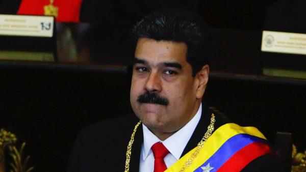 President of Venezuela Nicolás Maduro (L) looks on before talking to judges and members of the Supreme Justice Tribunal on its annual opening day of sessions in Caracas, Venezuela, on Jan. 24. (Getty Images)