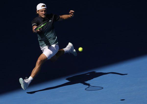 France's Lucas Pouille makes a forehand return to Canada's Milos Raonic during their quarterfinal match at the Australian Open tennis championships in Melbourne, Australia, on Jan. 23, 2019. (Mark Schiefelbein(AP Photo)