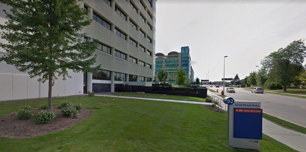 Officials in Milwaukee County, Wisconsin, said they are investigating the death of a woman who was found frozen to the ground in a parking lot near Froedtert Memorial Hospital, pictured above. (Google Street View)