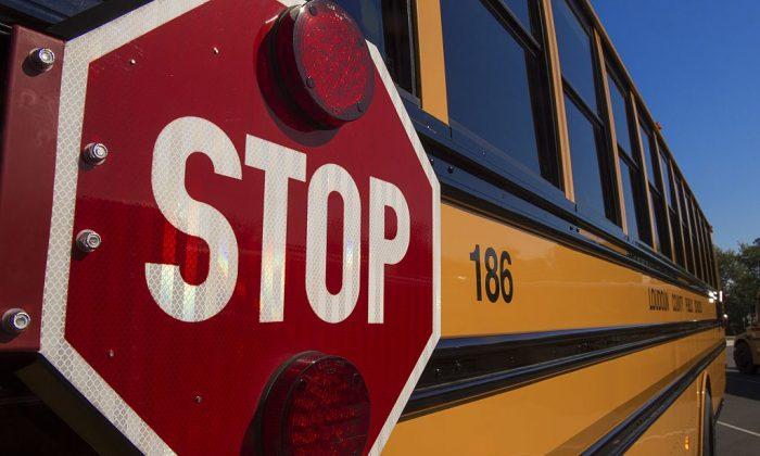 Police Officers Investigating Viral Video of Student Being Bullied on Bus