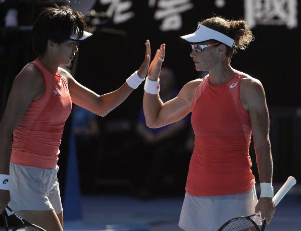 China's Zhang Shuai, left, and Australia's Samantha Stosur celebrate a point win over France's Kristina Mladenovic and Hungary's Timea Babos during the women's doubles final at the Australian Open tennis championships in Melbourne, Australia, on Jan. 25, 2019. (Mark Schiefelbein/AP Photo)