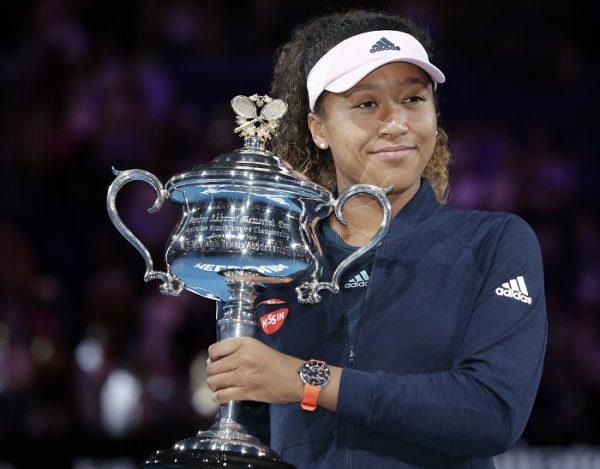 Japan's Naomi Osaka poses with her trophy after defeating Petra Kvitova of the Czech Republic in the women's singles final at the Australian Open tennis championships in Melbourne, Australia, on Jan. 26, 2019. (Aaron Favila/AP Photo)