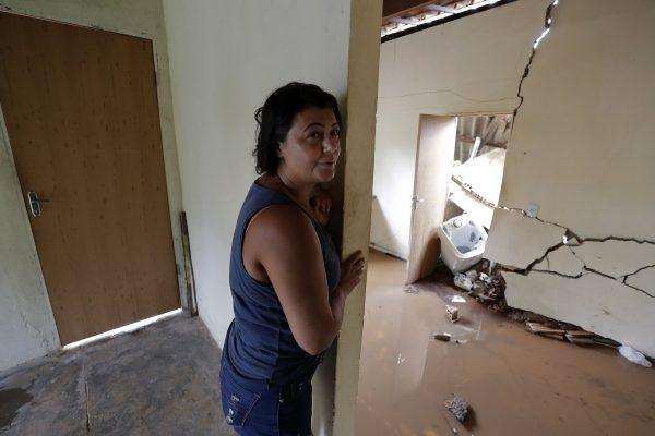 Isamara de Araujo stands inside her partially destroyed house after a dam collapsed in Brumadinho, Brazil, on Jan. 25, 2019. (Andre Penner/AP)