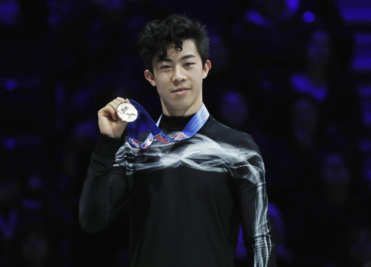 Nathan Chen holds his medal after winning the men's free skate during the U.S. Figure Skating Championships, Jan. 27, 2019, in Detroit. (AP Photo/Carlos Osorio)