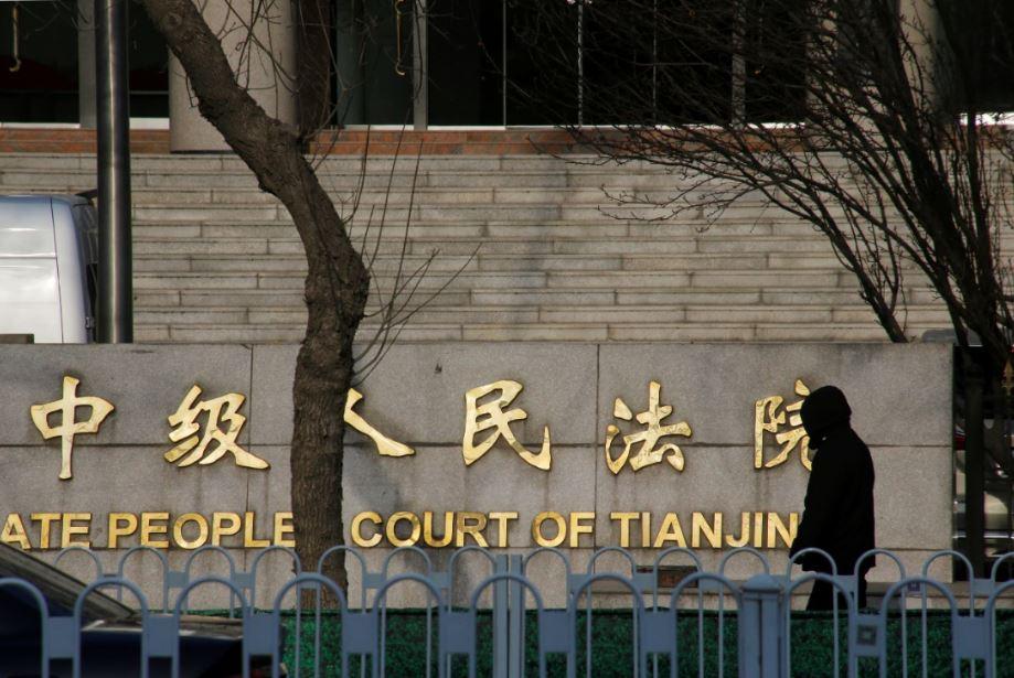 A man walks outside an Intermediate People's Court where prominent rights lawyer Wang Quanzhang was tried in Tianjin, China, on Dec. 26, 2018. (Thomas Peter/Reuters)