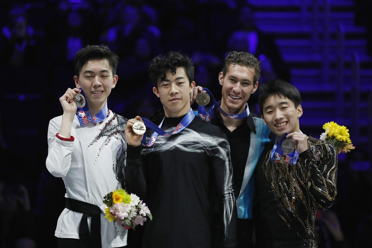 From left, second place finisher Vincent Zhou, winner Nathan Chen, third place Jason Brown and fourth place Tomoki Hiwatashi hold their medals after performing in the men's free skate during the U.S. Figure Skating Championships, Jan. 27, 2019, in Detroit. (AP Photo/Carlos Osorio)