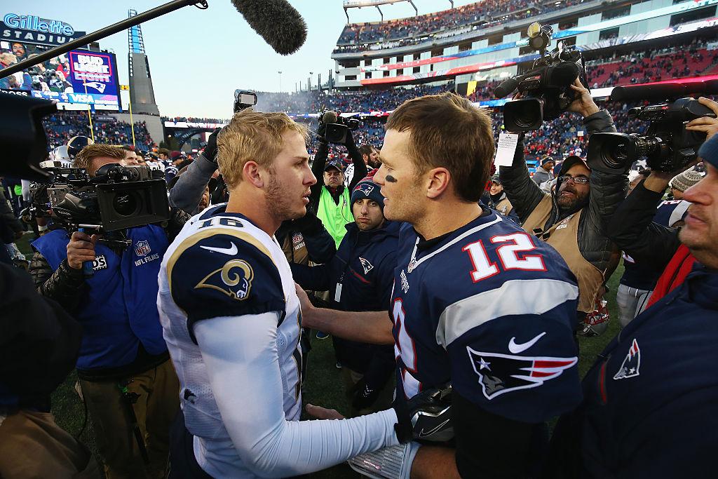 Jared Goff #16 of the Los Angeles Rams greets Tom Brady #12 of the New England Patriots after the New England Patriots defeated the Los Angeles Rams 26-10 at Gillette Stadium on Dec. 4, 2016 in Foxboro, Massachusetts. (Adam Glanzman/Getty Images)