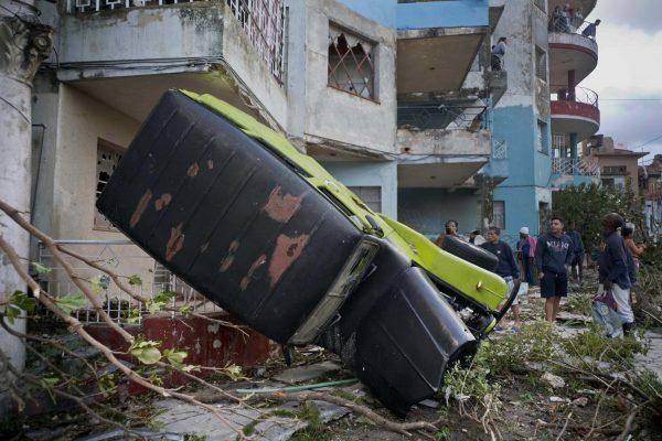 A truck is toppled against a home after a tornado in Havana, Cuba, on Jan. 28, 2019. (Ramon Espinosa/AP)