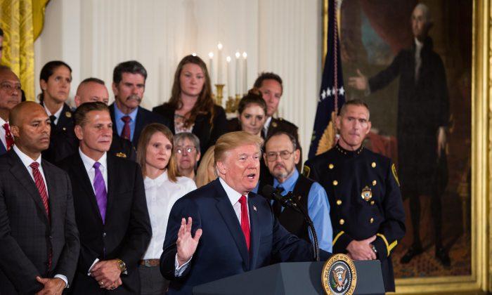 President Donald Trump officially declares the opioid crisis a nationwide public health emergency in the East Room of the White House, on Oct. 26, 2017. (Samira Bouaou/The Epoch Times)