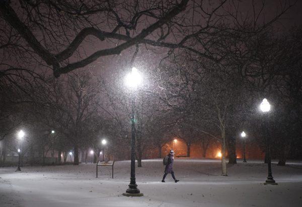 A woman walks across the snowy University of Minnesota campus near Dinkytown neighborhood in Minneapolis, on Jan. 27, 2019. (Jeff Wheeler/Star Tribune via AP)