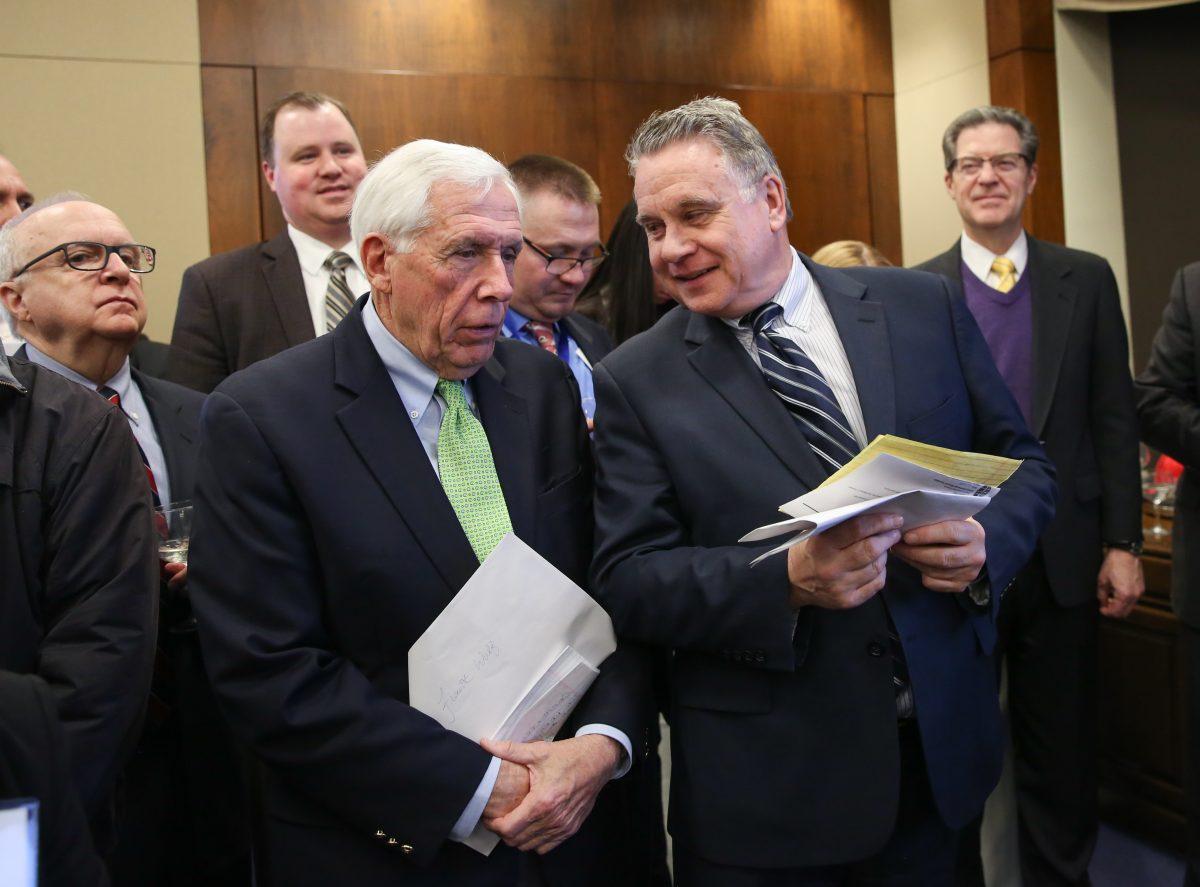Rep. Chris Smith (R-N.J.) (R) speaks with former Rep. Frank Wolf (R-Va.) at the Victims of Communism Memorial Foundation's Truman-Reagan Medal of Freedom award ceremony honoring the retired Cardinal of Hong Kong Joseph Zen at the Rayburn House Office Building on Capitol Hill in Washington on Jan. 28, 2019. (Samira Bouaou/The Epoch Times)