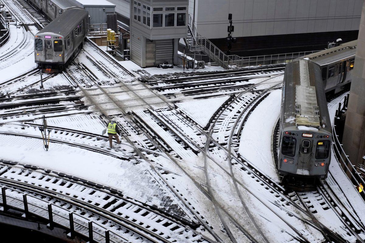 Chicago's El trains move along snow-covered tracks in Chicago, on Jan. 28, 2019. (Kiichiro Sato/AP Photo)