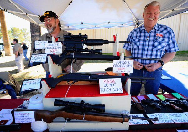 Vendors display hunting rifles for sale at the Crossroads of the West Gun Show at the Pima County Fairgrounds on Jan. 15, 2011, in Tucson, Ariz. (Kevork Djansezian/Getty Images)