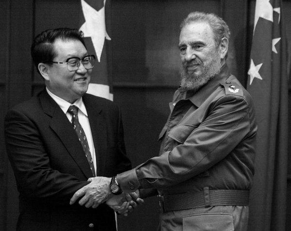  Cuban President Fidel Castro (R) shakes hands with Li Changchun, member of the Chinese Politburo Standing Committee, prior to a meeting at the Cuban State Council in Havana, on July 7, 2003. (Rafael Perez/AFP via Getty Images)
