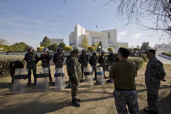 Pakistani troops surround the Supreme Court building as security is beefed up during the hearing of blasphemy case against Pakistani Christian woman Aasia Bibi, in Islamabad, Pakistan on Jan. 29, 2019. (B.K. Bangash/AP Photo)