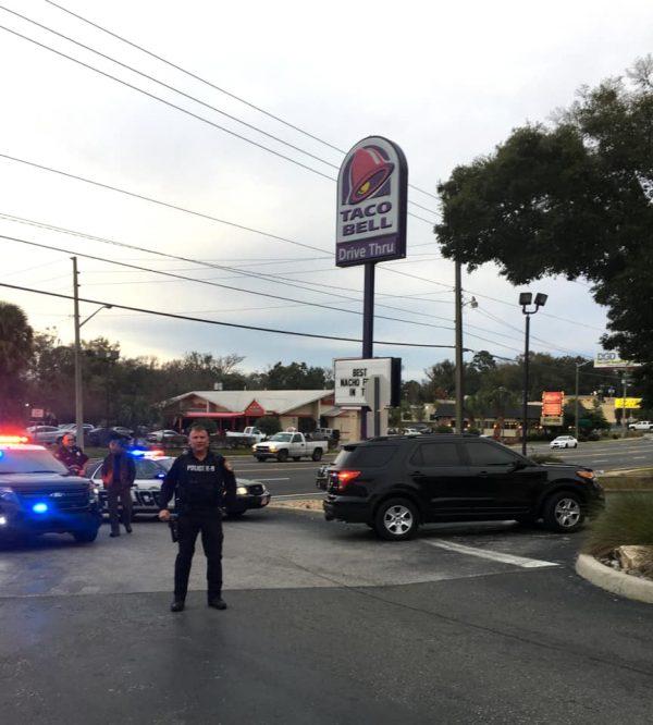 A police officer stands outside Taco Bell in Ocala during an evacuation on Jan. 26, 2019. (Ocala Police Department)