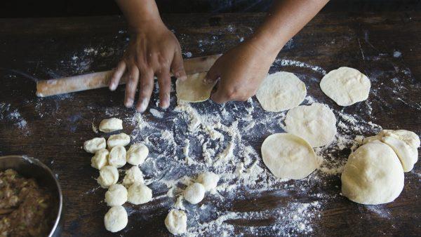 There's an art to rolling out the dough for homemade dumpling wrappers. (Clare Barboza)