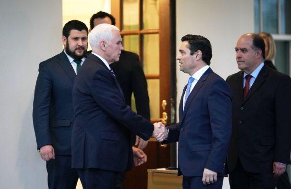 Vice President Mike Pence shakes hands with Venezuela's Charge d'Affaires Carlos Alfredo Vecchio following a meeting at the White House in Washington on Jan. 29, 2019. (Mandel Ngan/AFP/Getty Images)