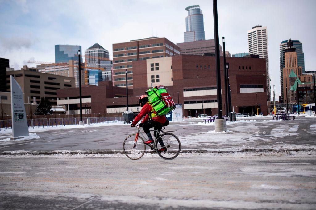 A bicyclist braves the cold while riding through downtown in Minneapolis, Minnesota on Jan. 29, 2019. (Stephen Maturen/AFP/Getty Images)