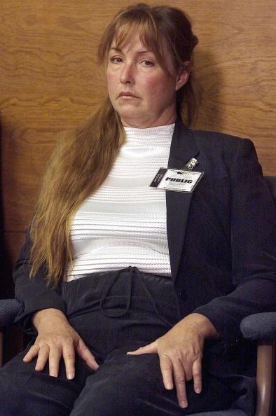 Debra Tate, sister of murder victim Sharon Tate, listens as Leslie Van Houten describes the events of the murder of the LaBianca couple during her parole hearing at the California Institution for Women in Corona, Calif., on June 28, 2002. (Damian Dovarganes/AFP/Getty Images)